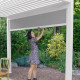 Pergola bioclimatique adossée en aluminium à lames inclinables 3x3 + store 3 M - Ombréa